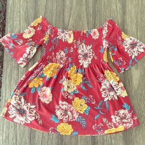 Off shoulder bohemian baby doll style top.